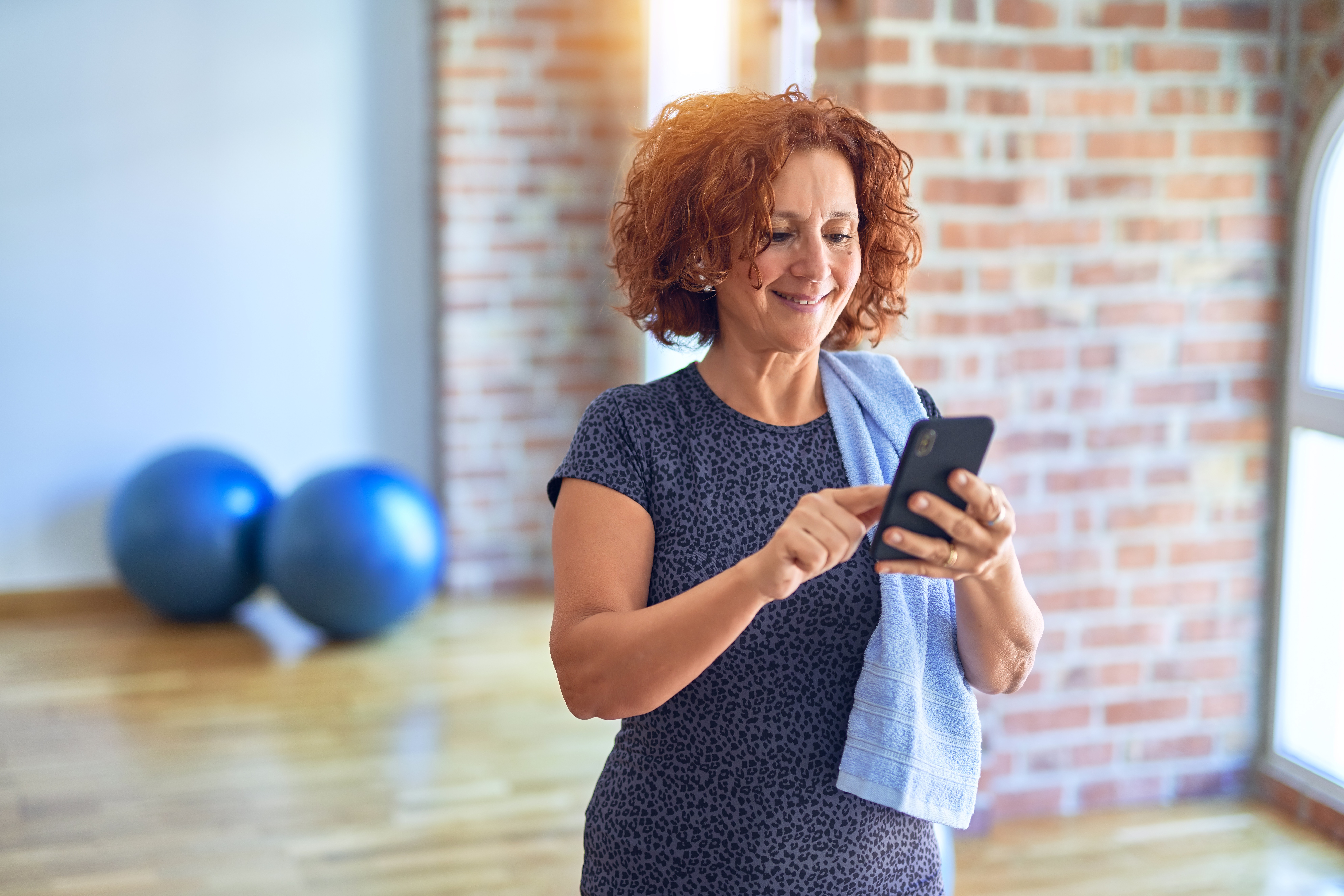 A patient comparing Halifax physiotherapy clinics on her phone