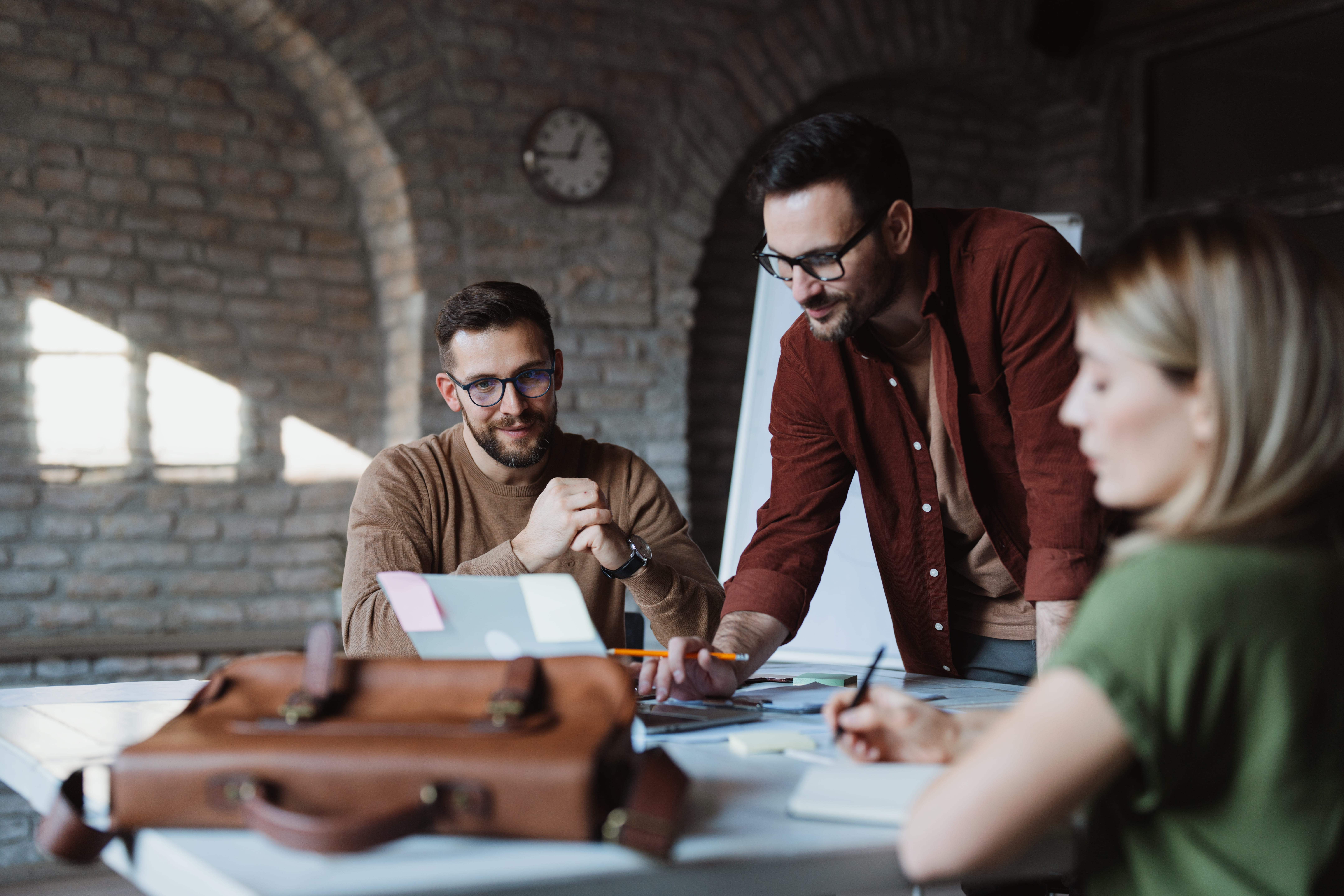 A team mapping marketing plans for clinics at different growth stages