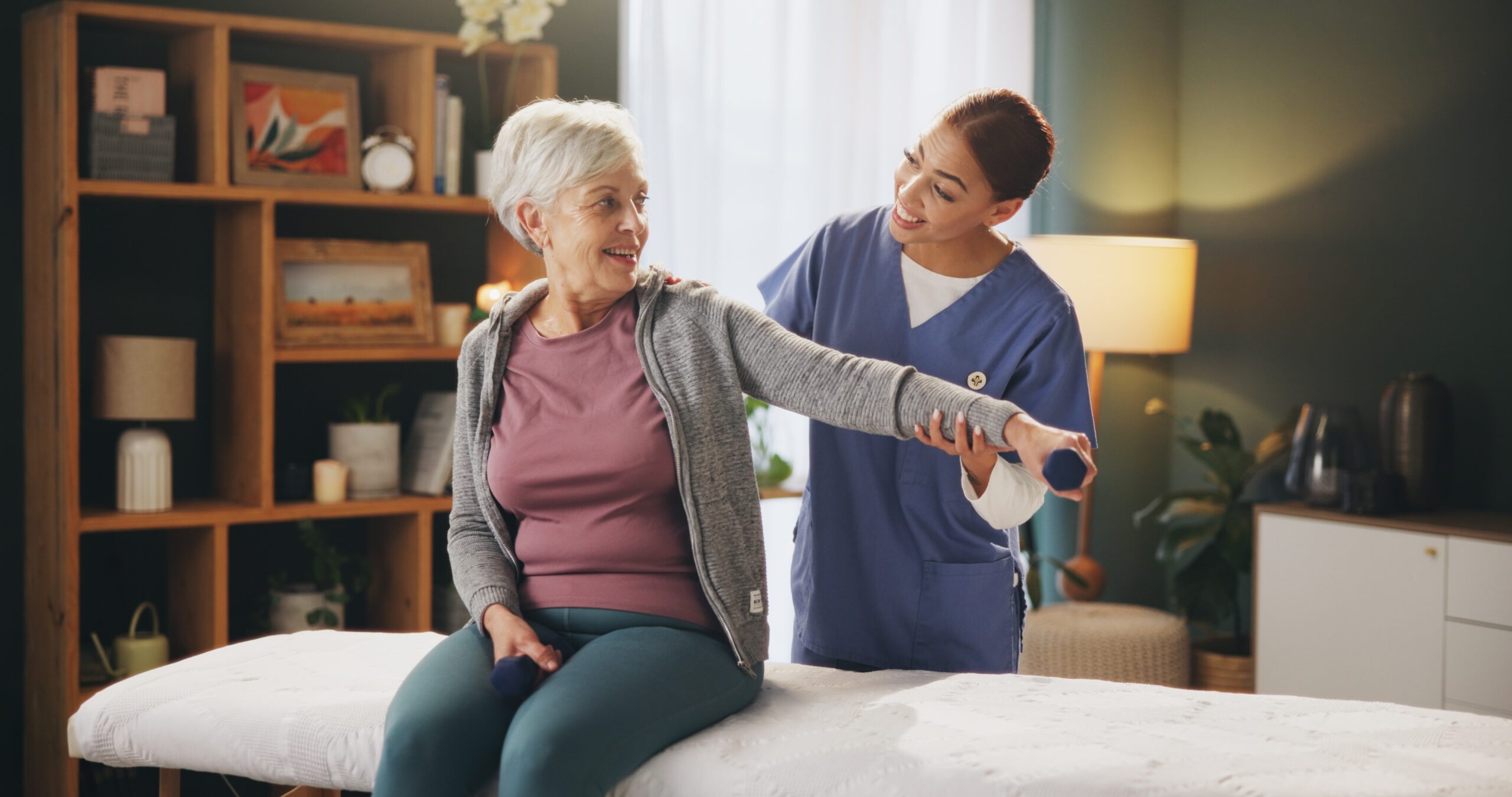 A physiotherapist treating a patient's shoulder in a Halifax clinic