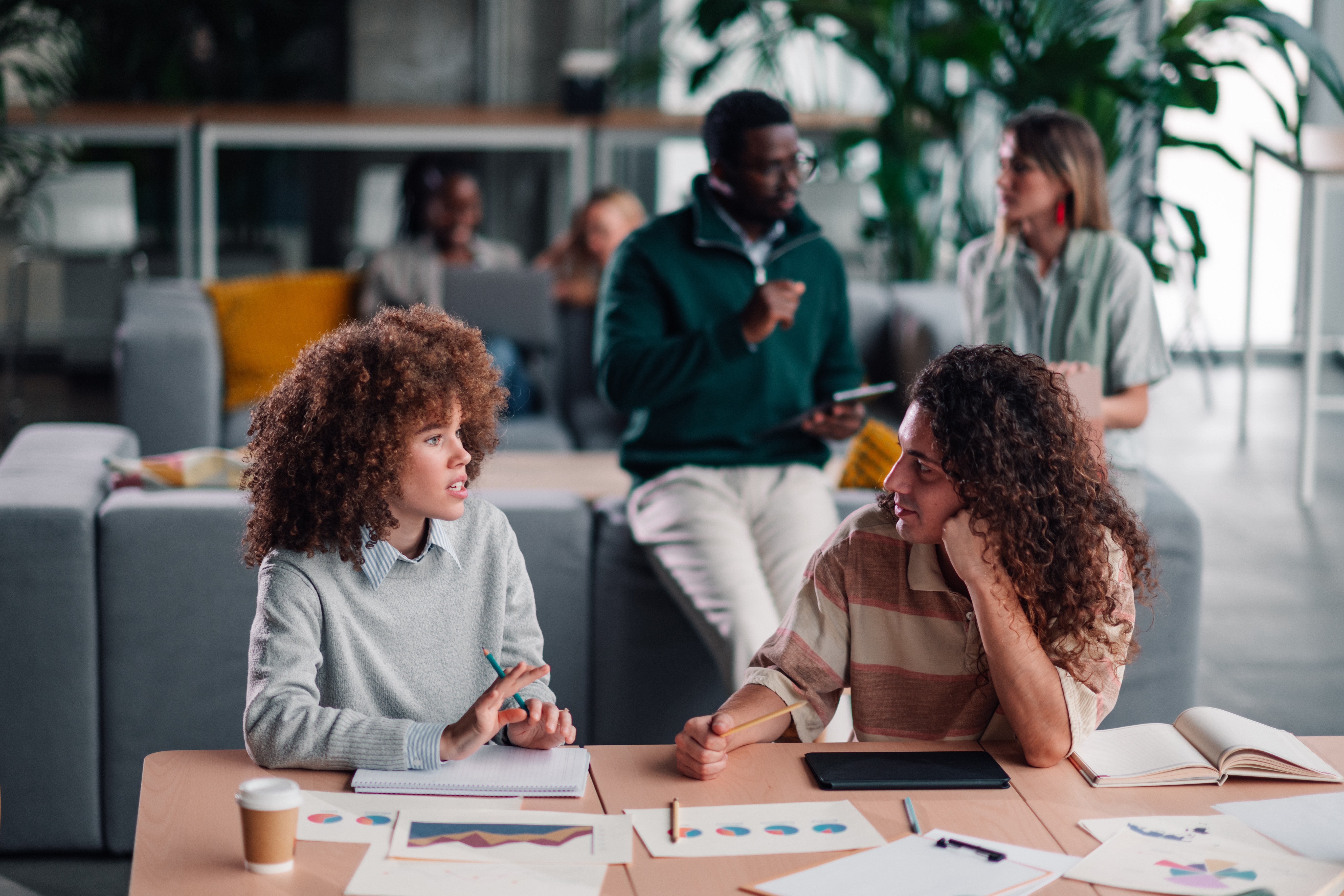 A team reviewing connected reporting together