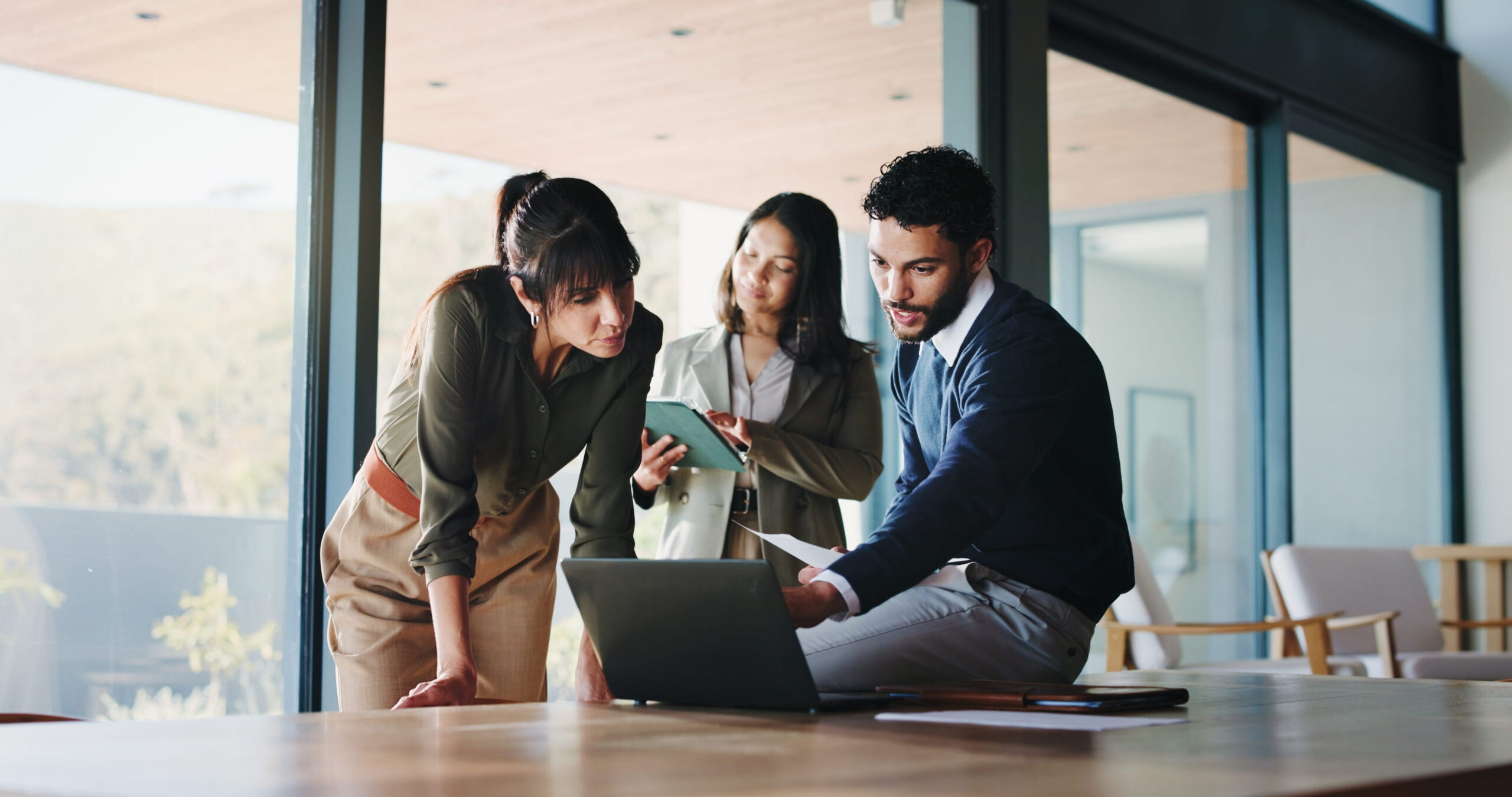 A team reviewing a campaign landing page on screen