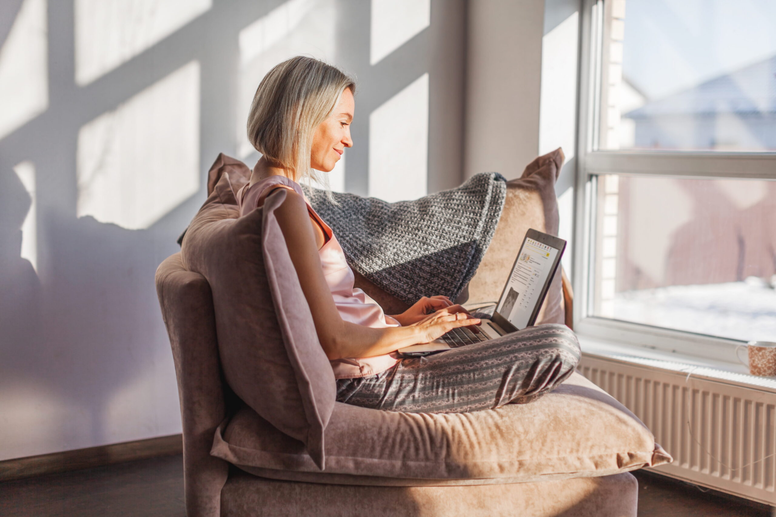 A patient searching for a physiotherapy clinic on her phone at home